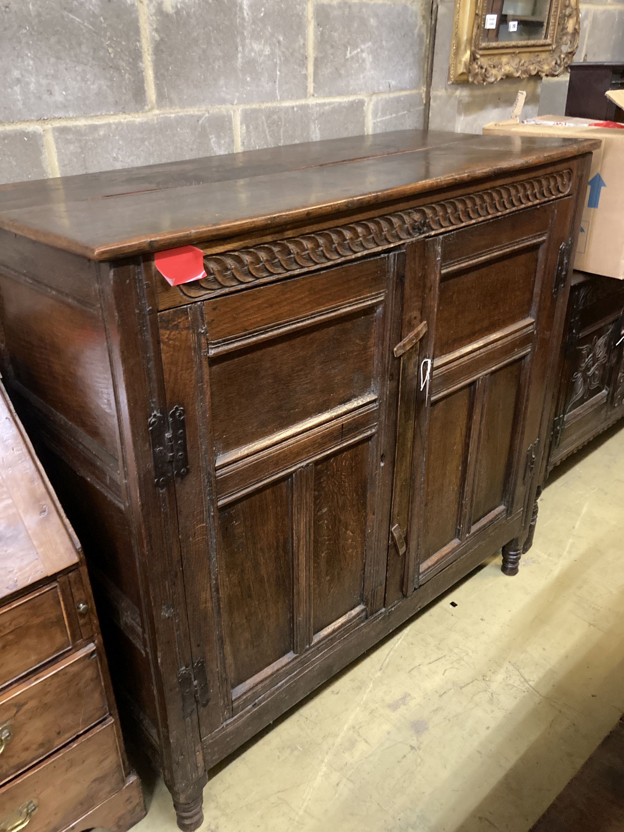 An 18th century panelled oak Livery cupboard (adapted), width 130cm, depth 57cm, height 128cm